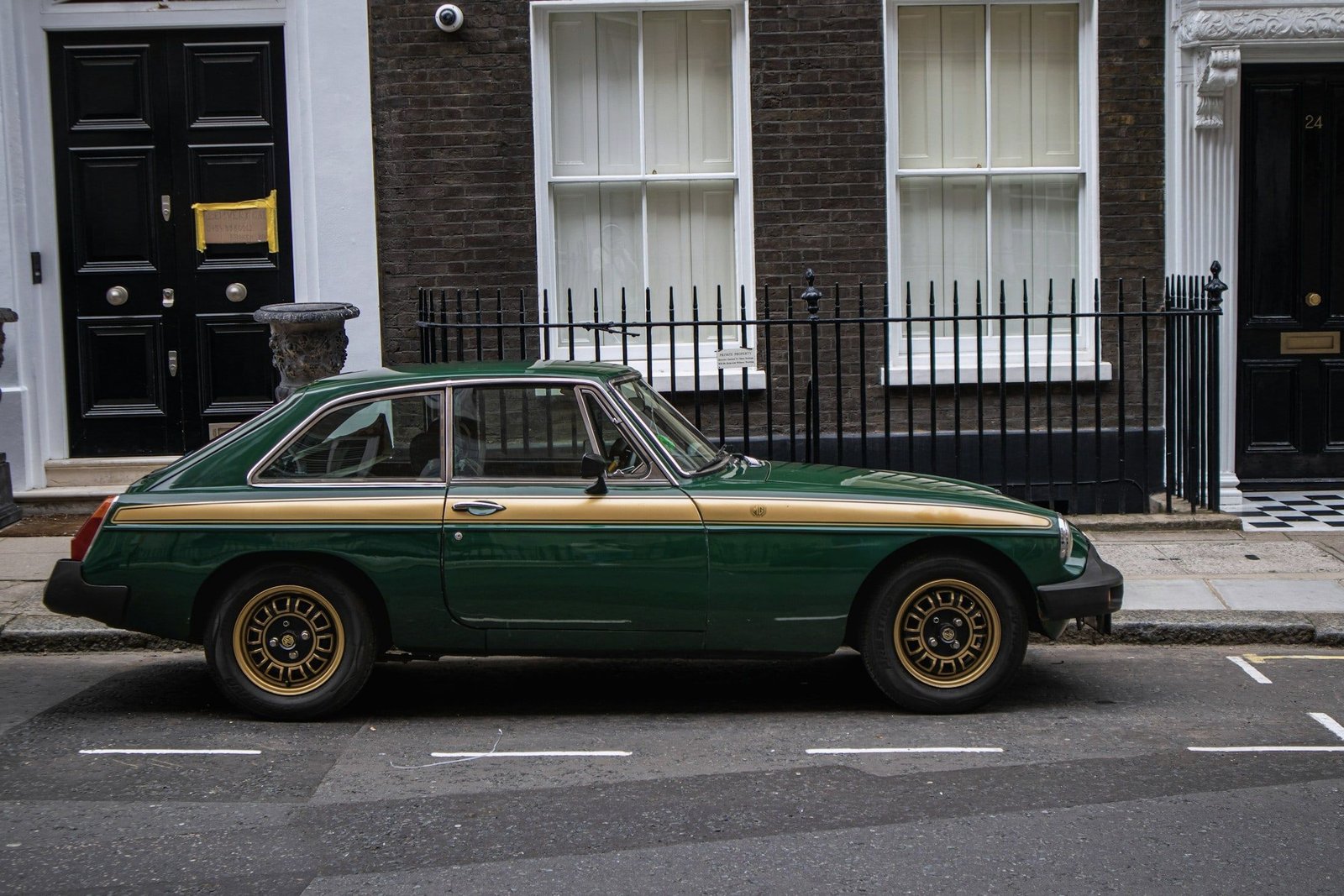 Green MGB GT on a Georgian London street