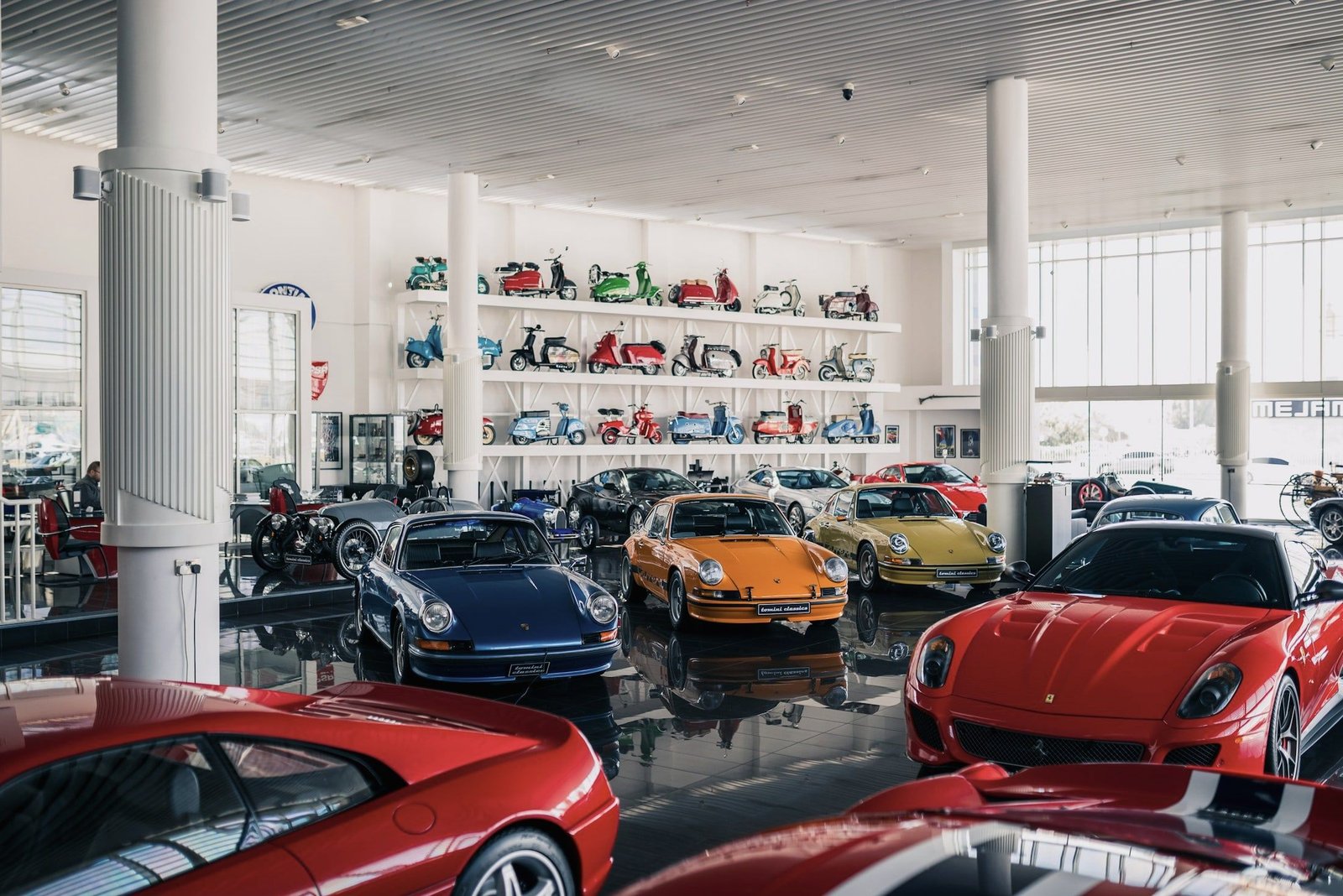 Classic sports cars in a bright showroom