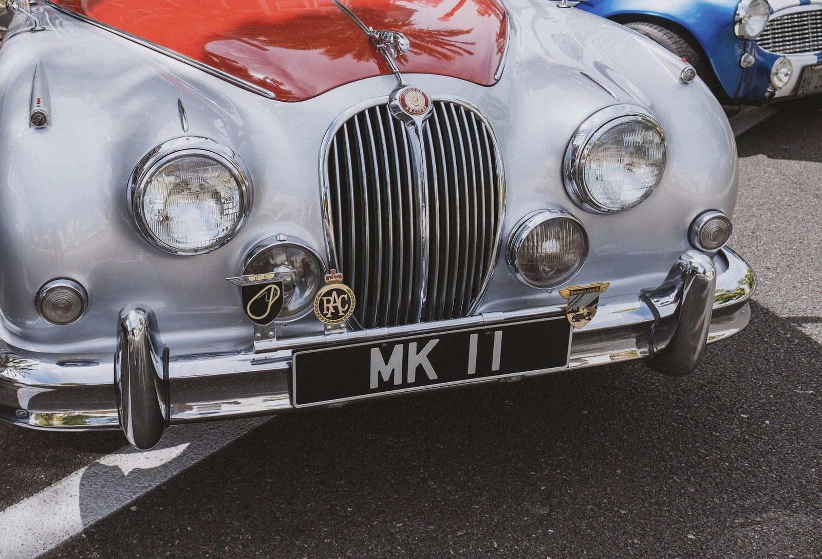 Chrome grille and number plate of a classic Jaguar